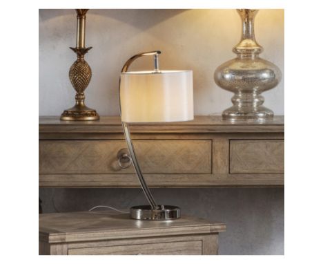 Josephine Table Lamp A contemporary take on a classic table lamp; this lamp has a curved steel base with a luxe fabric shade.