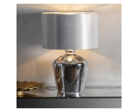 Waldorf Table Lamp The Waldorf glass table lamp has a high shine chromed glass base with an ivory faux silf shade. Fitted wit