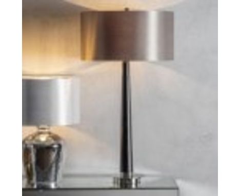 Corvina Table Lamp The Corvina is a walnut coloured, wooden table lamp finished in silver plate. This lamp is complimented by