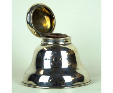 An Edwardian silver inkwell
Of circular baluster plain form, monogrammed to front, with flip hinged lid and replacement woode