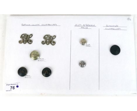 A collection of Berwick County Constabulary buttons and shoulder badges 
To include two B C Script in white metal, three butt