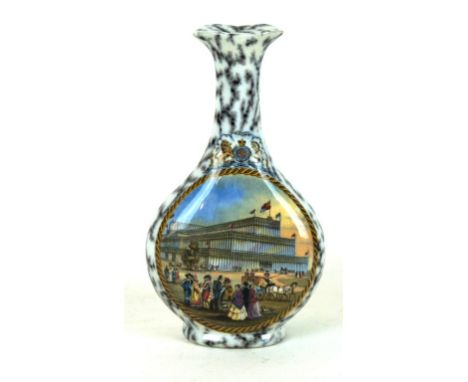 A 19th century Prattware sauce bottle
Decorated with a view of the Great Exhibition inside a mottled bored, height 17.5cm 
 C