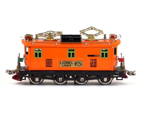 A Lionel Lines 'O' gauge 256 box cab electric locomotive
In orange with black chassis and light green window frames. (illustr