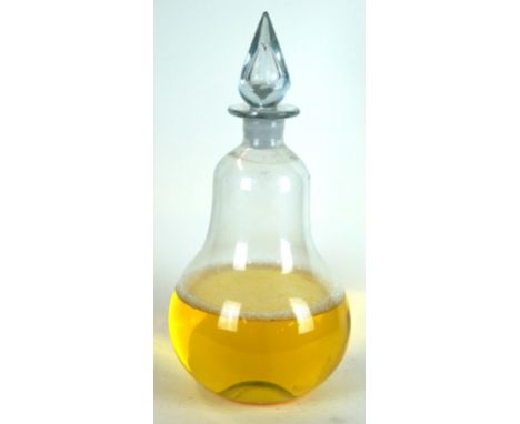 A Victorian glass apothecary chemist carboy
Modelled in the form of a pair, with pontil mark to base and diamond cut stopper,