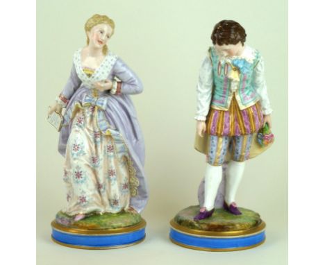 A pair of late 19th Century French porcelain figures
Depicting a gentleman and lady each wearing traditional attire, green pa