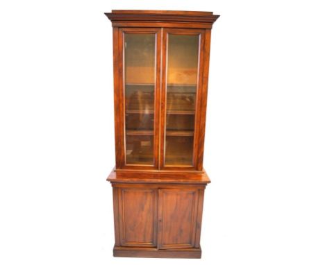 A Victorian mahogany tall library bookcase by Doveston, Bird & Hull
The moulded cornice above two glazed panelled doors enclo