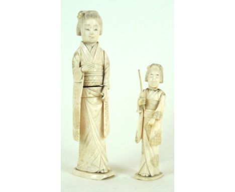 Two Japanese carved ivory sectional okimono, late Meiji Period (1868-1912)
Each carved as a bijin dressed in embroidered kimo