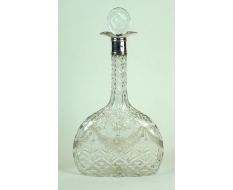 A silver and cut glass decanter
Of flattened baluster form, the silver collar to decorated cut glass with swag and foliate de