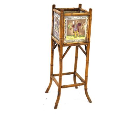 A late 19th Century Colonial bamboo plant stand applied with four ceramic tiles
The damaged tiles by E Smith & Co hand colour