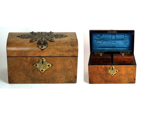 A Victorian walnut arch topped tea caddy
Having applied brass floral decoration, with two interior covers, 15x23cm

