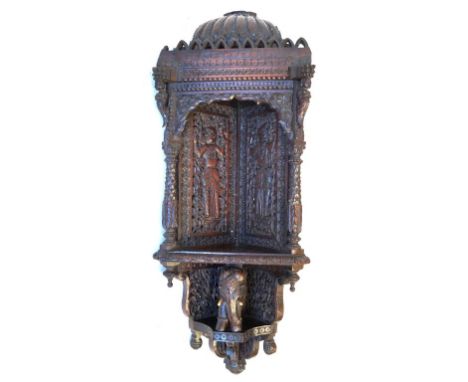 A Indian carved hardwood shelf, Circa 1890 
The unusually carved single tier shelf, with carved architectural upper section, 