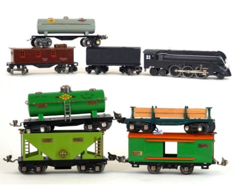 A Lionel 'O' gauge 2-6-4 locomotive - 221 type
With eight wheel twin bogey tender in black livery together with a timber wago