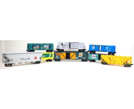 Eighteen unboxed Lionel freight cars 
Including 'The Progressive Way' hopper wagon, Valley Forge Express hopper wagon, Stingr