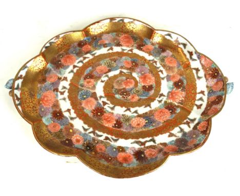 A Japanese Kutani tray, early 20th Century 
The flowerhead shaped tray, flanked by twin relief moulded flowerbud form handles