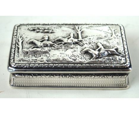 Of hunting interest: A silver snuff box
Of rectangular form, the cover embossed with a scene of three gentleman following the