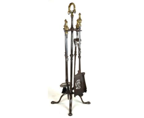 A set of Regency style brass handled and steel fire tools
Height of stand 74cm

