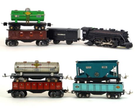 A Lionel 'O' gauge 2-6-2 locomotive, no. 1666
With four wheel tender in black livery together with a Sunoco tanker no. 2654, 