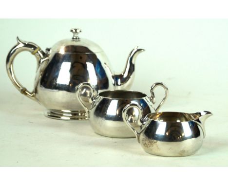 A Victorian silver bachelor's three piece tea service
Of plain circular form, the tea pot with ivory insulators, comprising; 