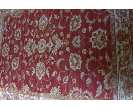 A Zeigler carpet
On a mainly red ground, the central panel with multiple floral decoration, flanked by multiple florally deco