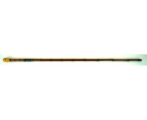 A late 19th Century bamboo and ivory headed swordstick 
71cm blade with acid etched decoration, bamboo grip with carved ivory