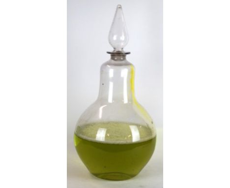 A Victorian glass apothecary chemist carboy
Modelled in the form of a pair, with pontil mark to base and teardrop stopper, ha