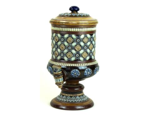 A Doulton Lambeth Art Ware water filter and cover
Having relief geometric decoration, complete with ceramic tap, height 35cm
