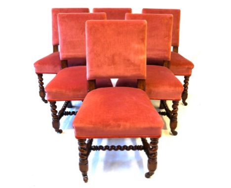 A set of six Victorian oak dining chairs 
Each of solid construction and featuring upholstered padded back panels incorporati