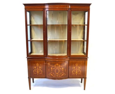 An elegant Edwardian marquetry inlaid mahogany tall display cabinet
Featuring a bowed centre section, the upper section with 