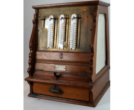 A rare international cash register 
Having stained beech wooden frame, with three bevelled mirror plates and three ceramic pl