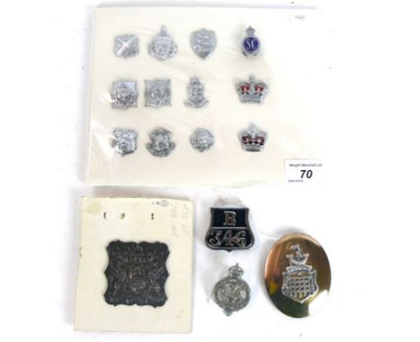 A collection of assorted police and military badges, late 19th/early 20th Century 
To include an oval belt buckle in gilt met