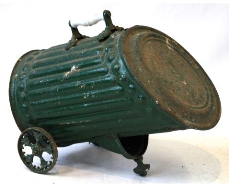 A Victorian green painted tin coal bin
The fluted cylindrical form with hinged lid, ceramic carrying handle, and twin wheels,