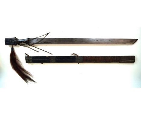 An African tribal sword, late 19th/early 20th Century
70cm straight single edged blade with hatchet point, with leather and w