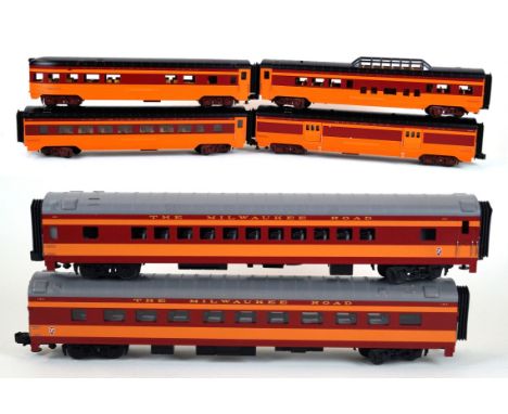 A boxed Rail King by MTH Milwaukee Road
4- car 60' streamline passenger set no. 30-1489P and a boxed MTH Milwaukee Road 2-car