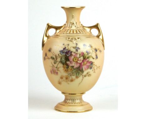 A Royal Worcester blush ivory twin handled urn
Having hand-painted floral decoration, puce factory marks and date code for 19