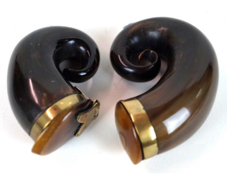 Two Victorian horn snuff mulls
Each with brass collars, length of largest example 7cm.
