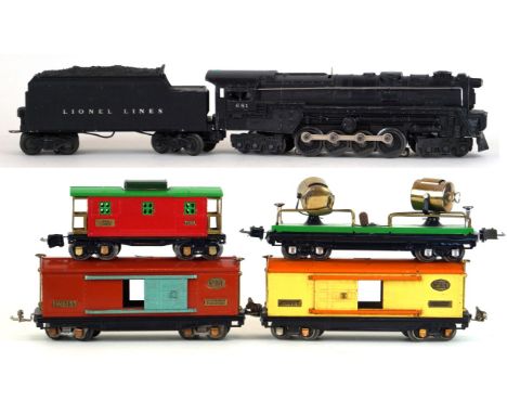 A Lionel 'O' gauge 681 locomotive 
With eight wheel twin bogey tender in black livery, together with two automobile furniture