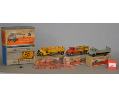 Two boxed Dinky Toys 513 Guy Flat Truck with Tailboard diecast model, F/G with some paint loss, in F plain card lidded box wi