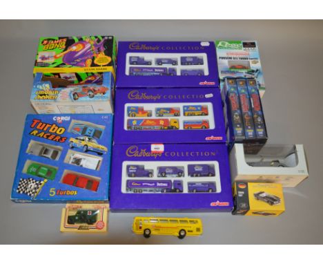 A mixed group of toys including three boxed Majorette 'Cadbury's' miniature diecast model sets, a boxed Corgi C43 Turbo Racer