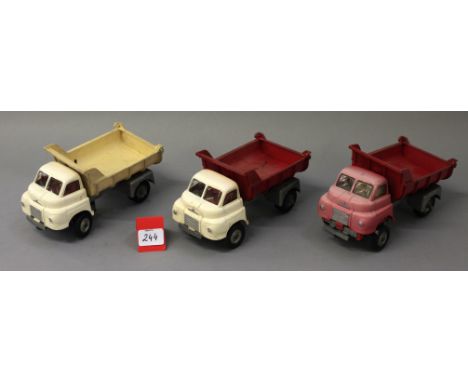 Three unboxed large scale Bedford 'S' type Tipper Truck models, approximately 23cm long. Although unbranded they are thought 