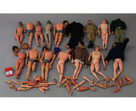 Palitoy Action Man. A number of figures, one intact, nine heads with nine incomplete bodies,  together with two extra bodies 