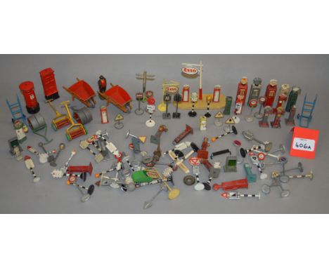 A quantity of unboxed playworn diecast models by Dinky Toys and others including road signs and other items of street furnitu