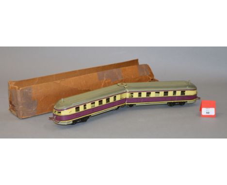 O gauge. Marklin 'Flying Hamburger' diesel-electric 20v locomotive, 1930s. The violet and cream locomotive has one head light