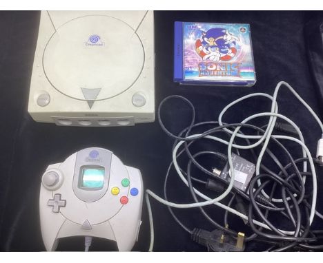 Sega Dreamcast tech unit with hand held remote and a boxed adventure Game ( untested at point of consignment) in good order t