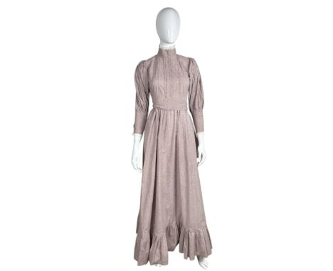 A 1976 Laura Ashley prairie dress in a soft mole brown /antique white with a historic ditsy print. This was taken in at the L