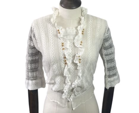 A group of Victorian and Edwardian bodices and waists to include a late Edwardian blouse in white lace with decorative amber 