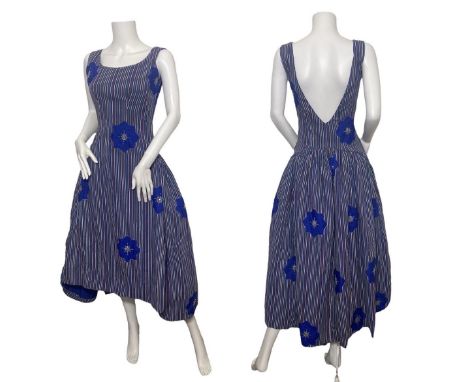 A &nbsp;group of 1950s fashions to include a 1950s novelty print dress with Egyptian theme, the print by John wolf, a 1950s/6