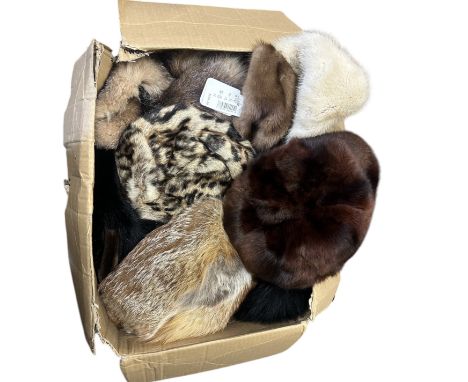 A box of vintage fur hats and head bands to include examples in mink, fox and sable. There is a printed mink hat which has a 