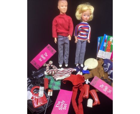 Pedigree Sindy and Paul 1965 teen fashion dolls with a selection of clothes to include outfit pieces, shoes and accessories -