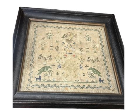 A 19th century sampler by Mary Skinner, undated. Embroidered on linen with the name sitting on either side of a crown with th