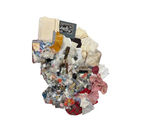 A quantity of vintage and antique fabrics, buttons and trimmings that were collected for the restoration of antique teddy bea